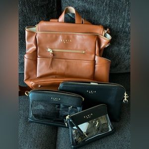 Brand new Elkie & Co diaper bag includes 3 smaller bags and a changing pad